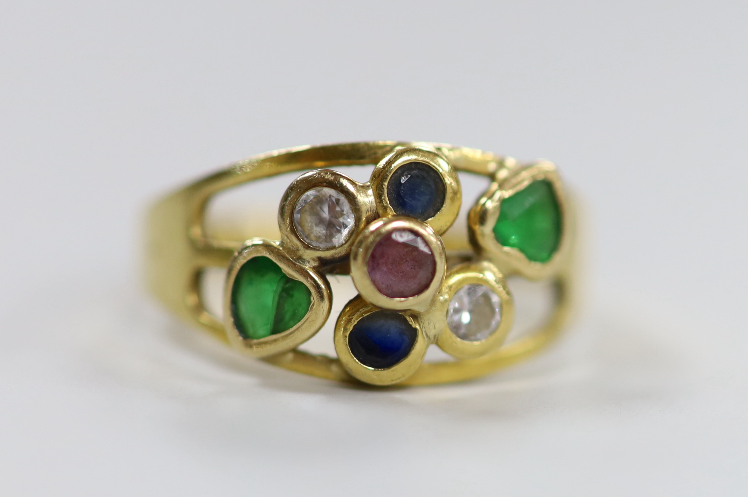 A modern Italian 750 yellow metal and seven stone multi gem collet set ring, size O, gross weight 2.8 grams.